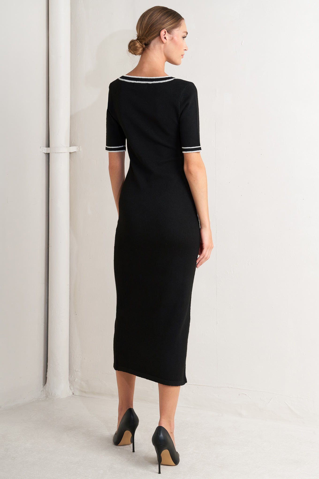 A sweater knit midi dress featuring square neckline, short sleeve and front button detail