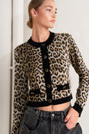 A sweater knit cardigan with round neckline, long sleeve and front button closure