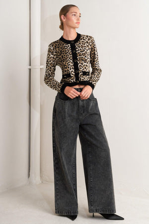 A sweater knit cardigan with round neckline, long sleeve and front button closure