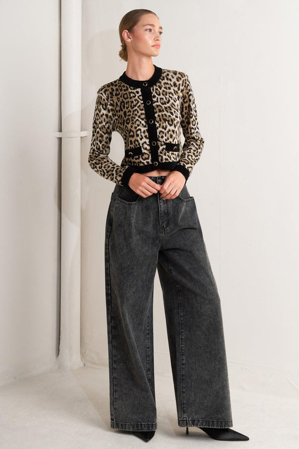 A sweater knit cardigan with round neckline, long sleeve and front button closure