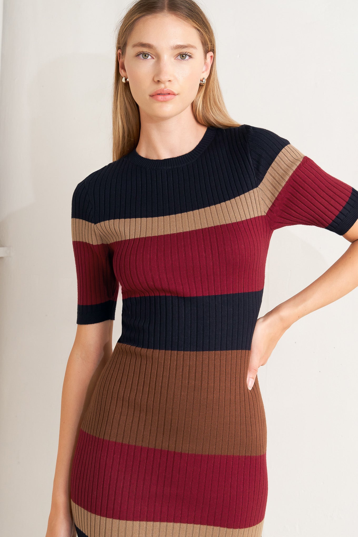 A ribbed color blocked midi sweater dress with round neckline and short sleeve