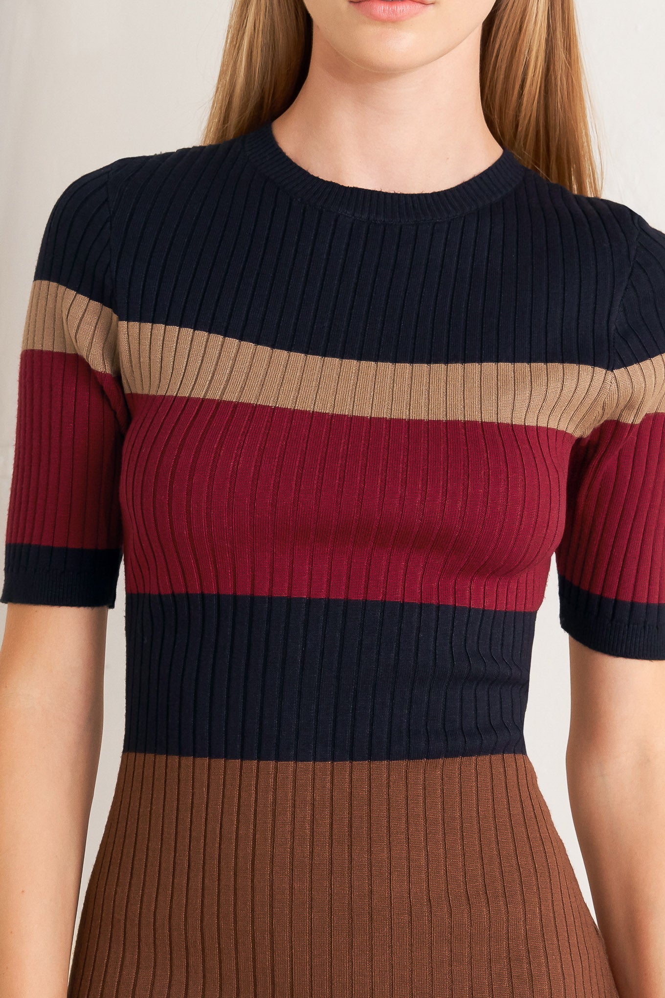 A ribbed color blocked midi sweater dress with round neckline and short sleeve