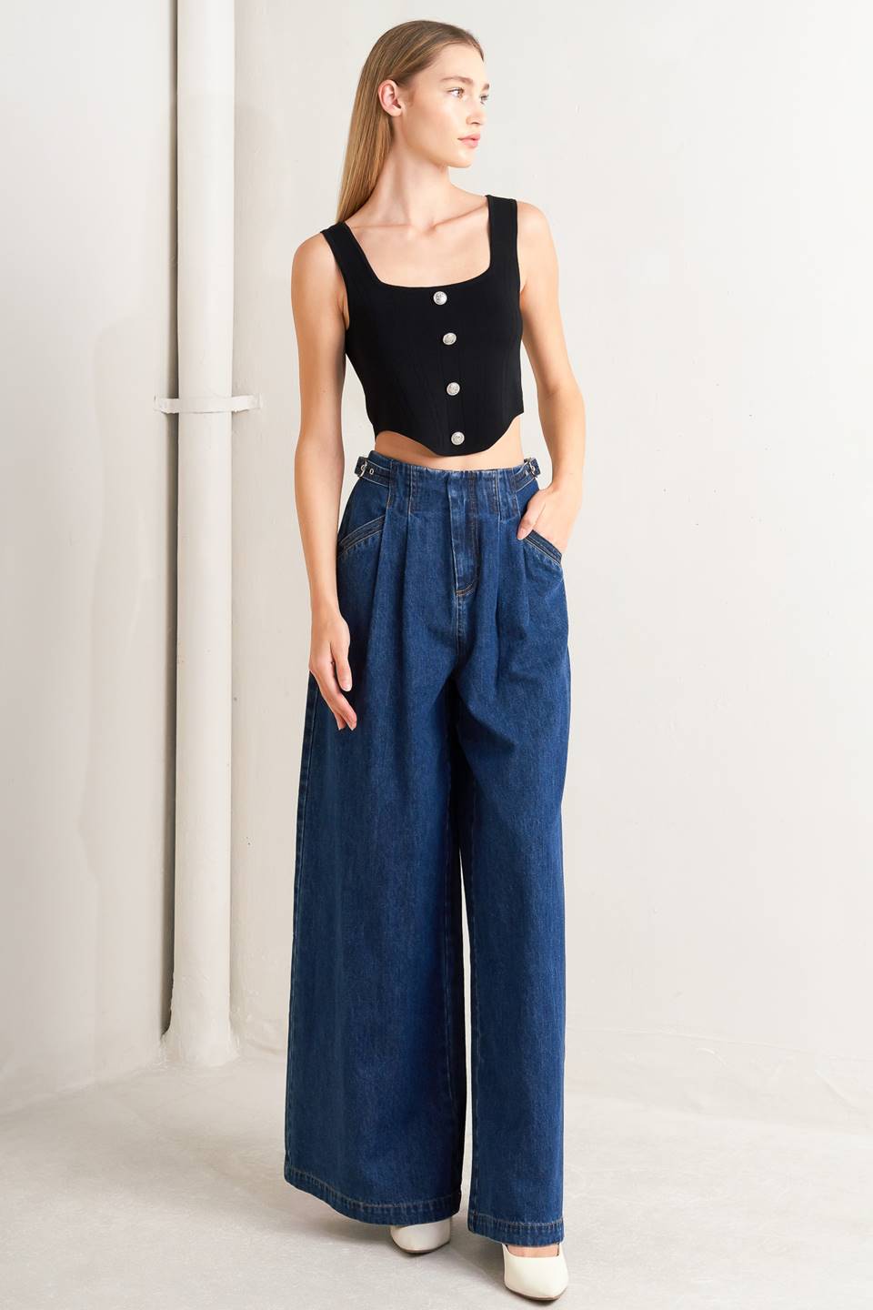 A sweater top featuring square neckline, sleeveless and button front detail