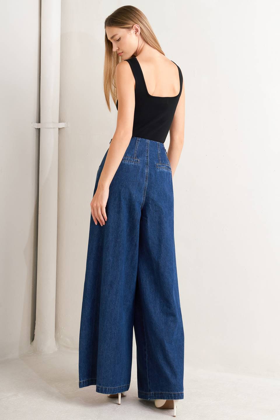 A sweater top featuring square neckline, sleeveless and button front detail