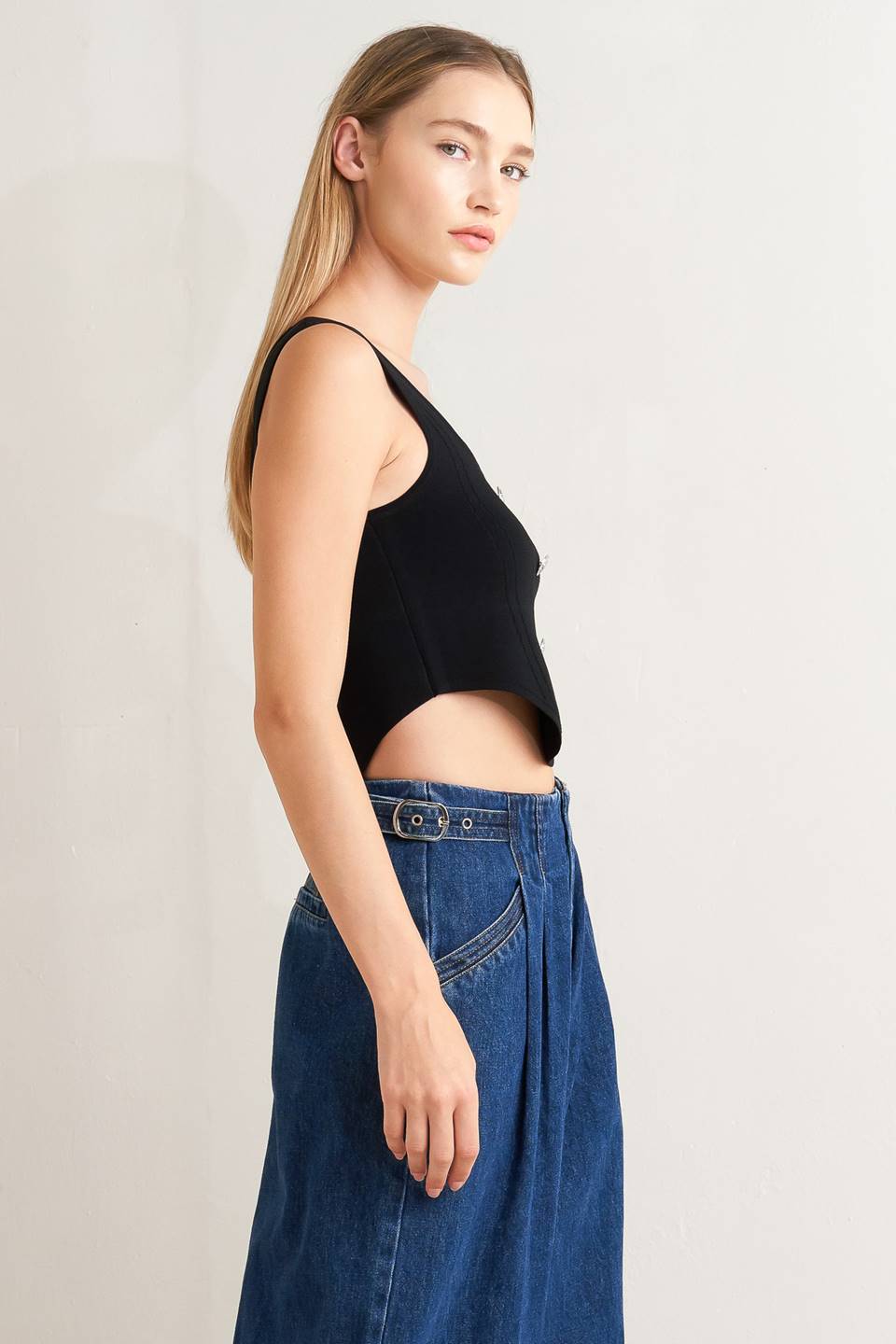 A sweater top featuring square neckline, sleeveless and button front detail