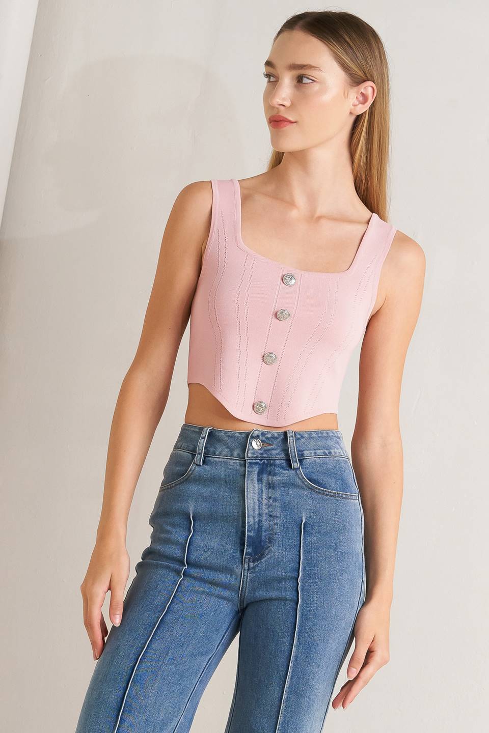 A sweater top featuring square neckline, sleeveless and button front detail