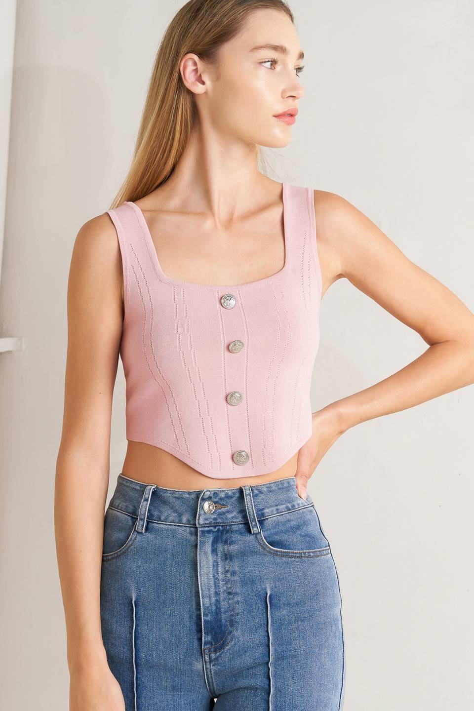 A sweater top featuring square neckline, sleeveless and button front detail