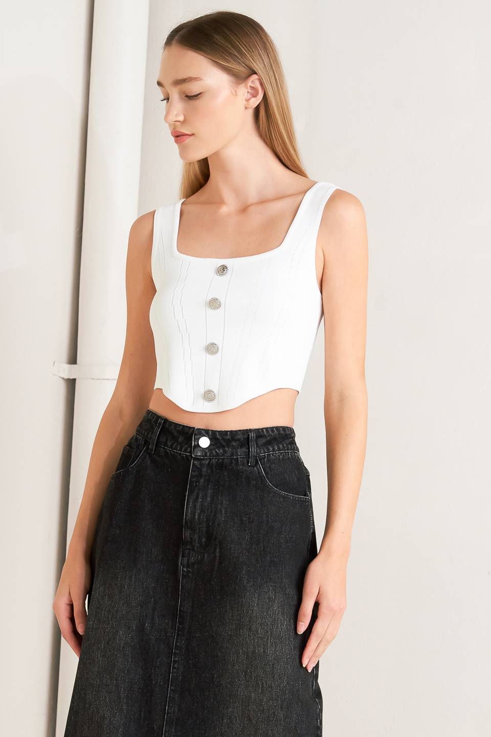 A sweater top featuring square neckline, sleeveless and button front detail