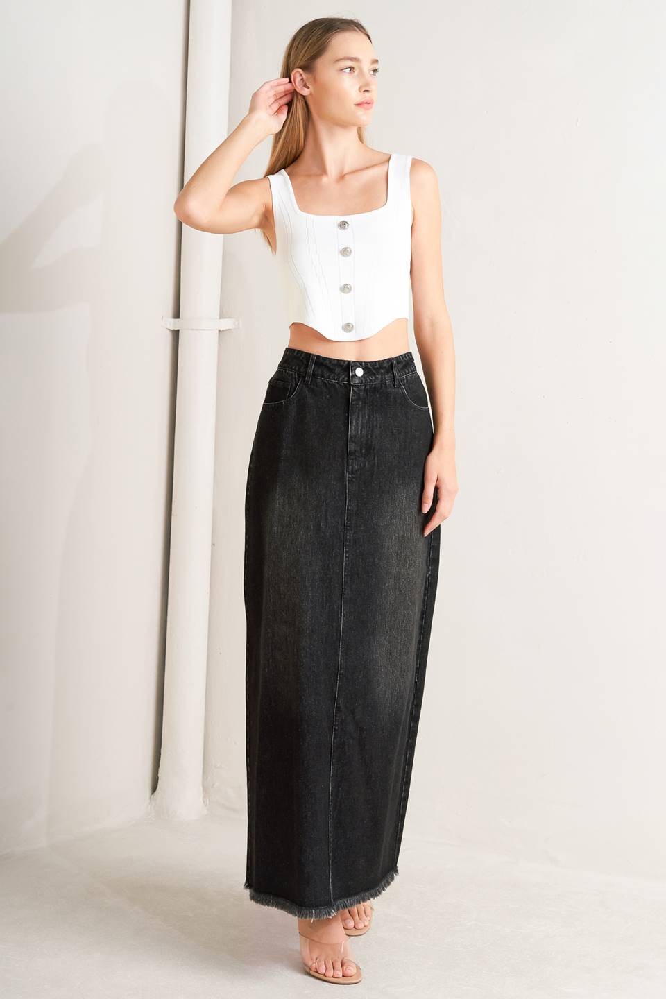 A sweater top featuring square neckline, sleeveless and button front detail