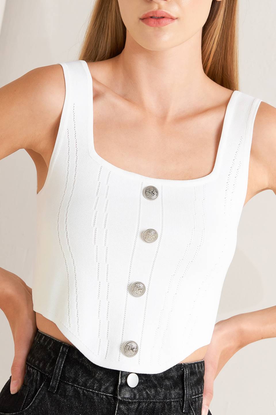 A sweater top featuring square neckline, sleeveless and button front detail