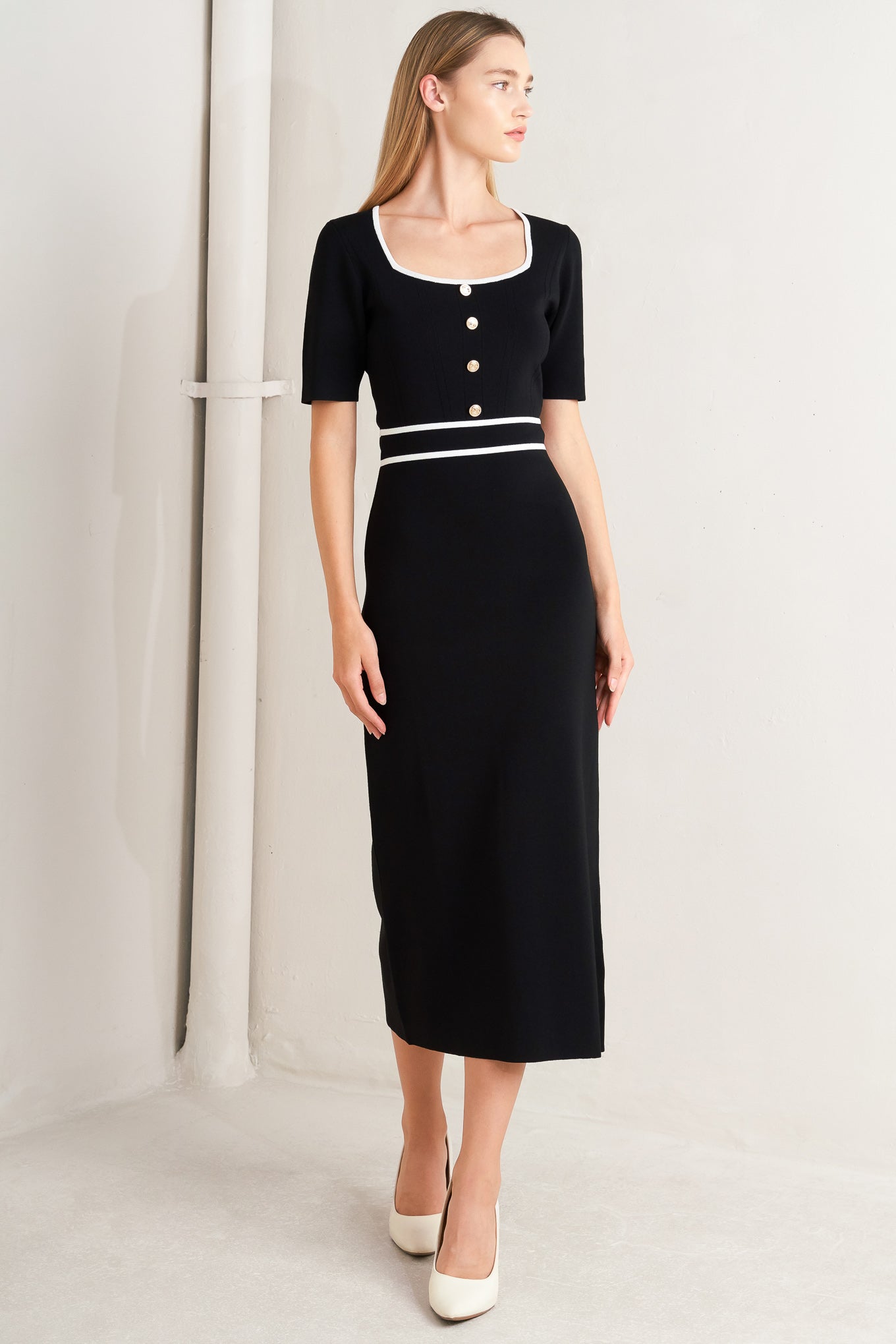 A sweater knit midi dress featuring square neckline, short sleeve and front button detail