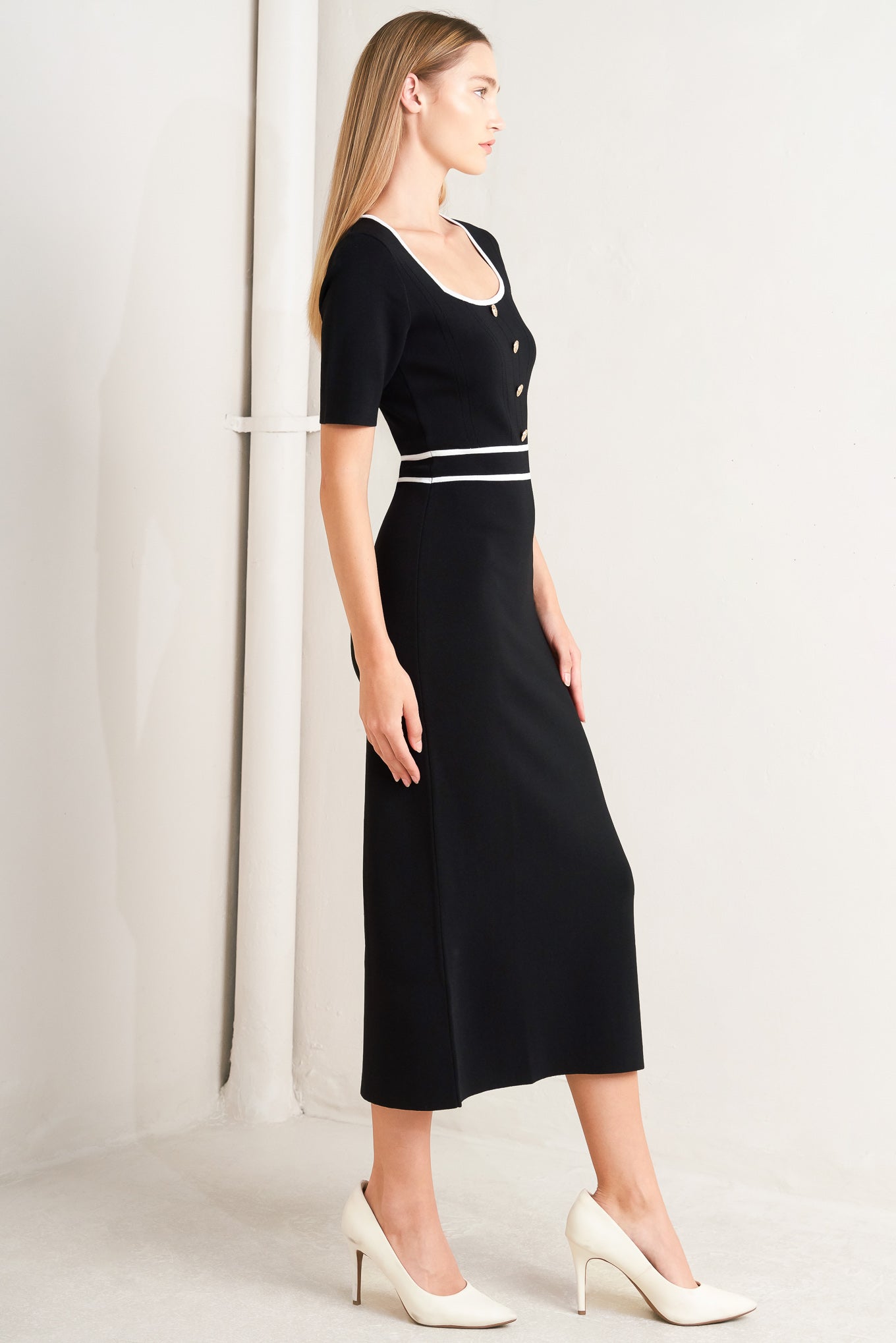 A sweater knit midi dress featuring square neckline, short sleeve and front button detail