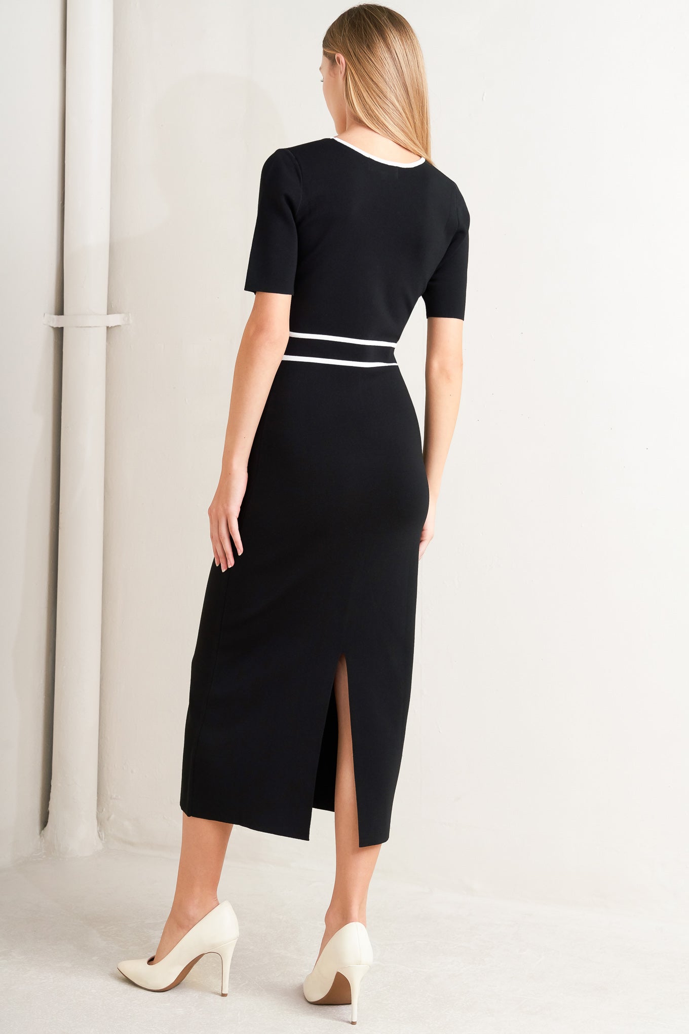 A sweater knit midi dress featuring square neckline, short sleeve and front button detail