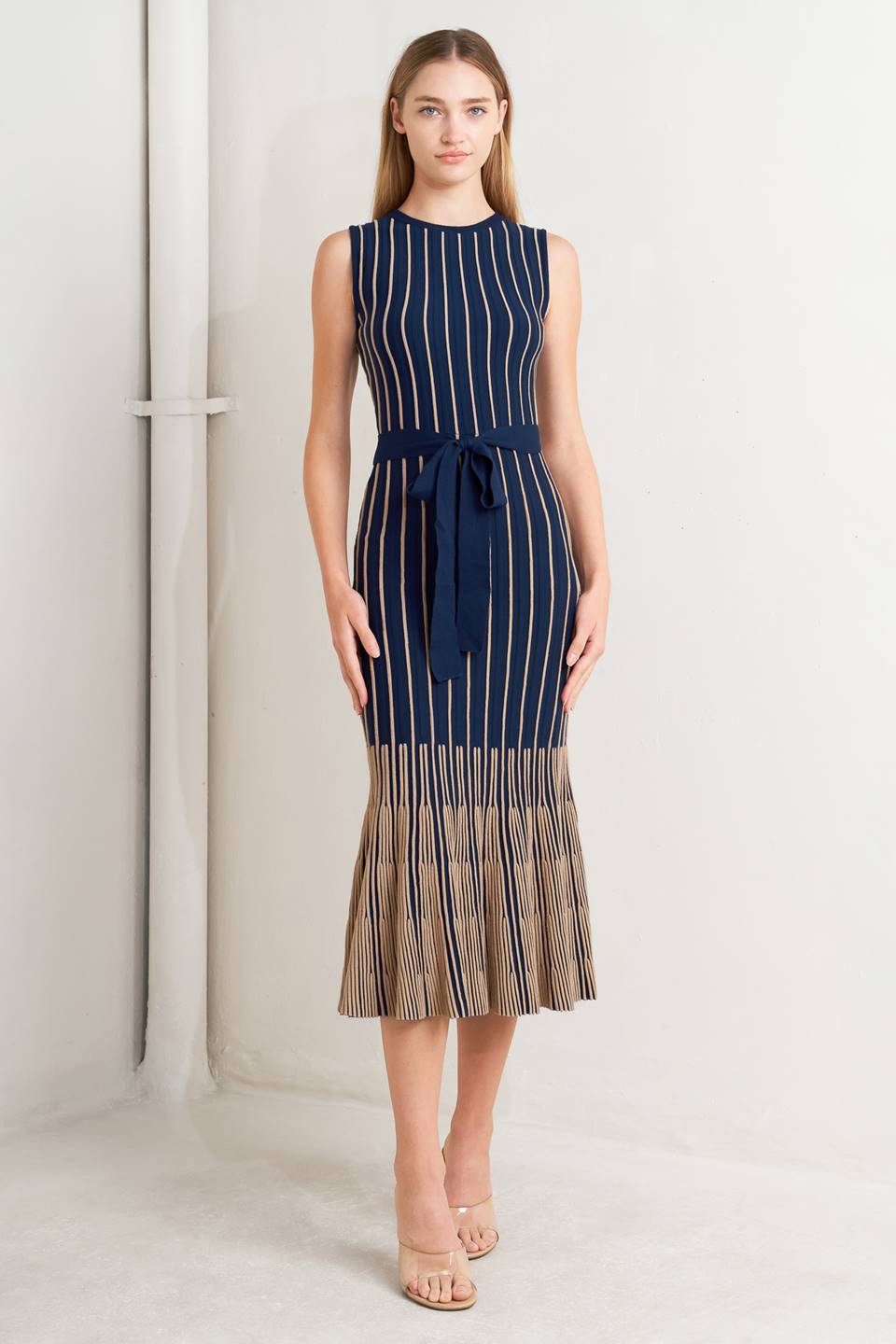 Woman wearing a sleeveless dress with vertical stripes on a white background - Flying Tomato