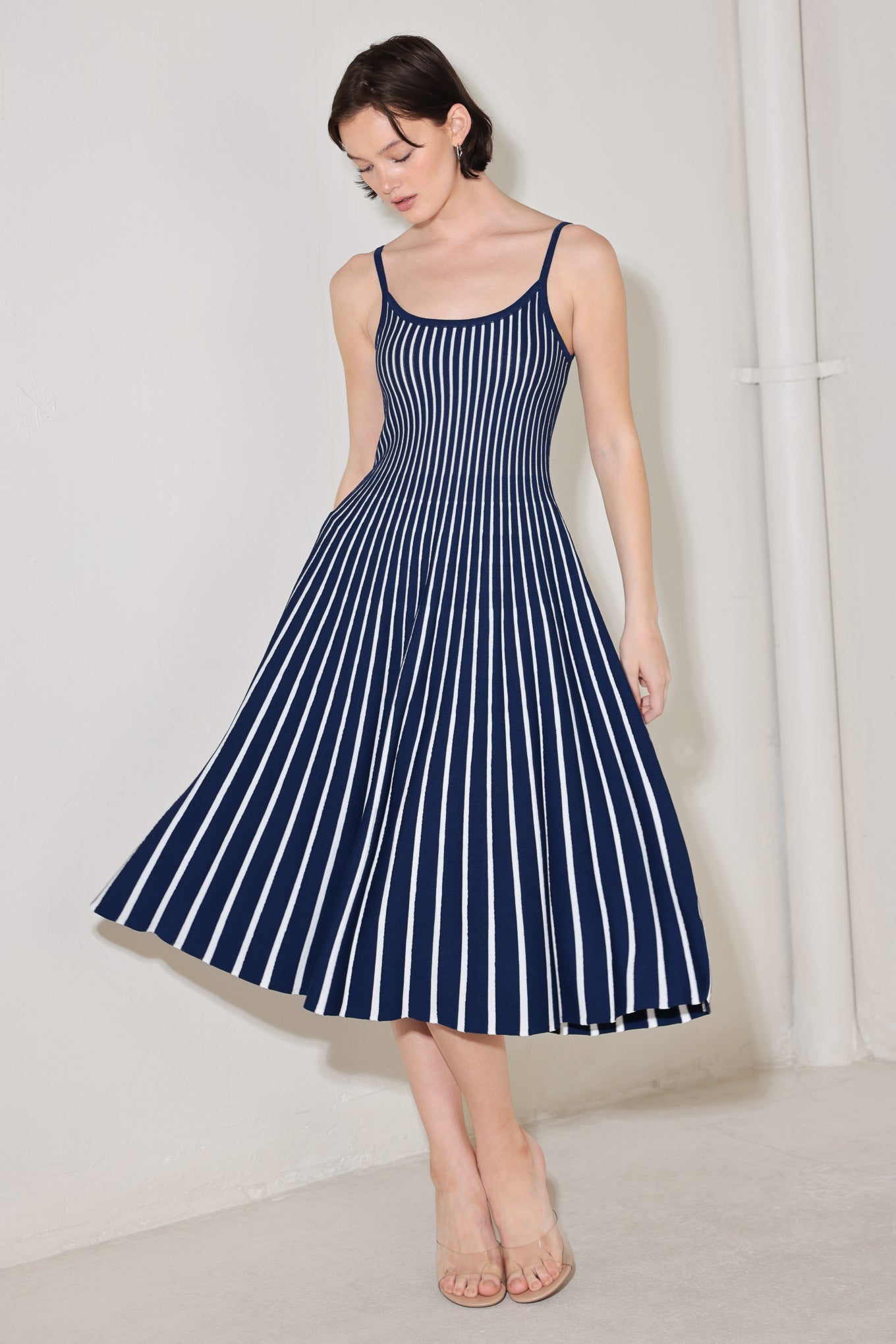 
A sweater knit midi dress featuring U neckline, straps and circle skirt

Details:

Self : 60% Polyester 40% Viscose

Size &amp; Fit

- Model is 5`8" And Wearing Size Small
- Measurements Taken From Size Small
- Approx. Length: 46"