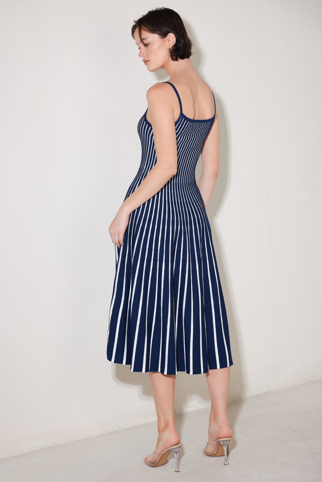 
A sweater knit midi dress featuring U neckline, straps and circle skirt

Details:

Self : 60% Polyester 40% Viscose

Size &amp; Fit

- Model is 5`8" And Wearing Size Small
- Measurements Taken From Size Small
- Approx. Length: 46"
