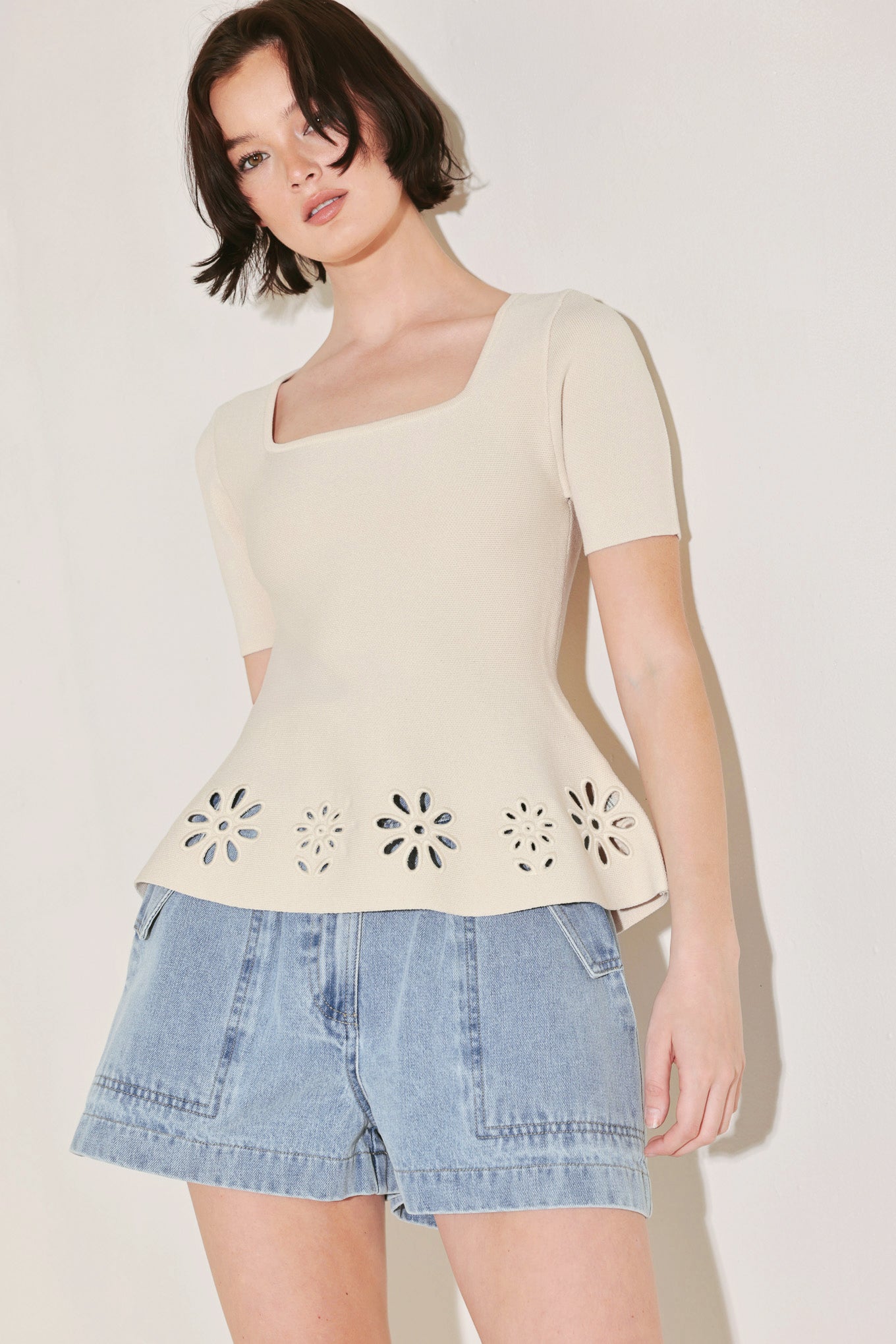 
A sweater knit top featuring square neckline, short sleeve and eyelet cut out detail

Details:

Self : 60% Polyester 40% Viscose

Size &amp; Fit

- Model is 5`8" And Wearing Size Small
- Measurements Taken From Size Small
- Approx. Length: 23"