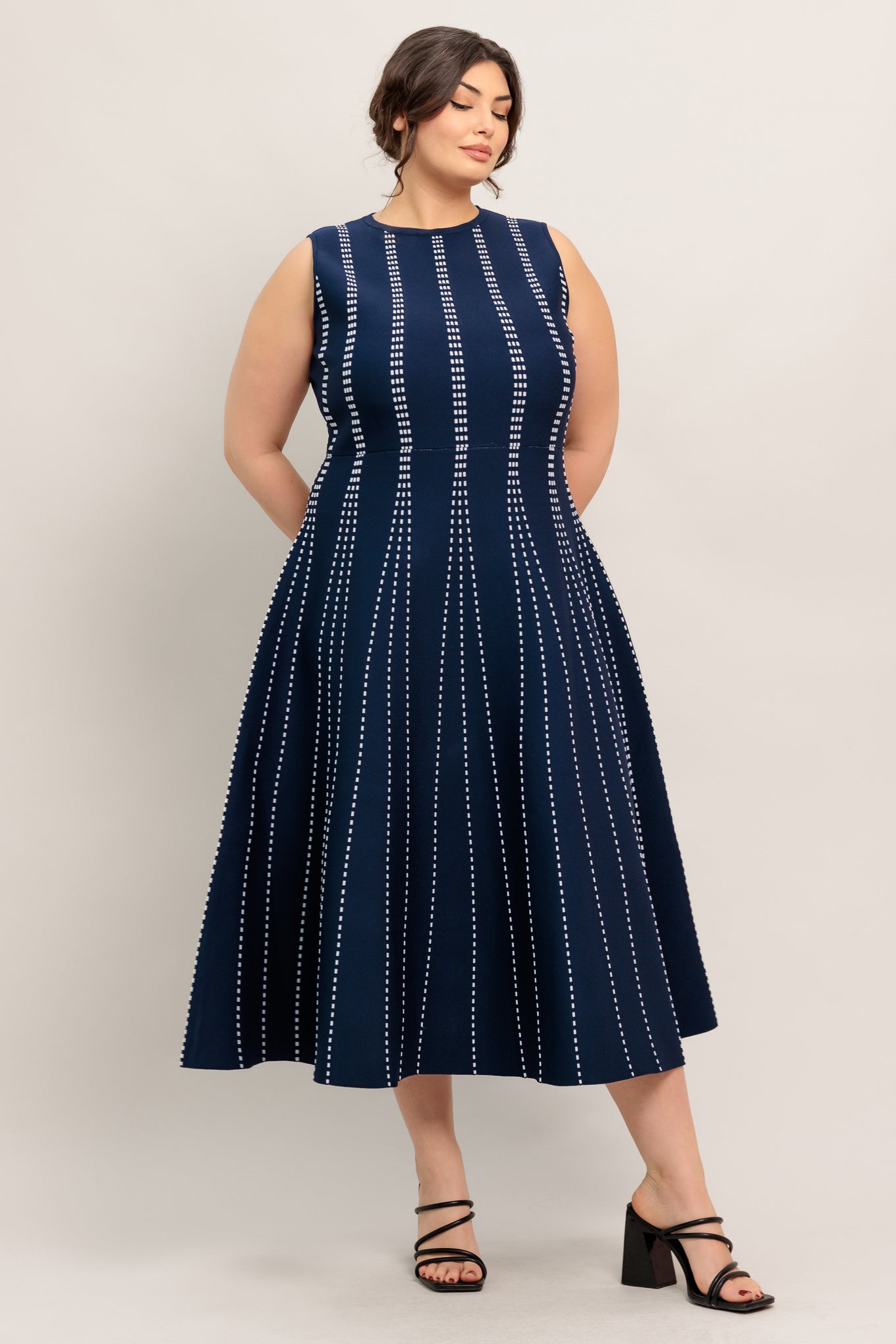 
A jacquard sweater knit midi dress featuring round neckline, sleeveless and circle skirt

Details:

Self : 82% Polyester 18% Spandex

Size &amp; Fit

- Model is 5`8" And Wearing Size Small
- Measurements Taken From Size Small
- Approx. Length: 50" Flying Tomato