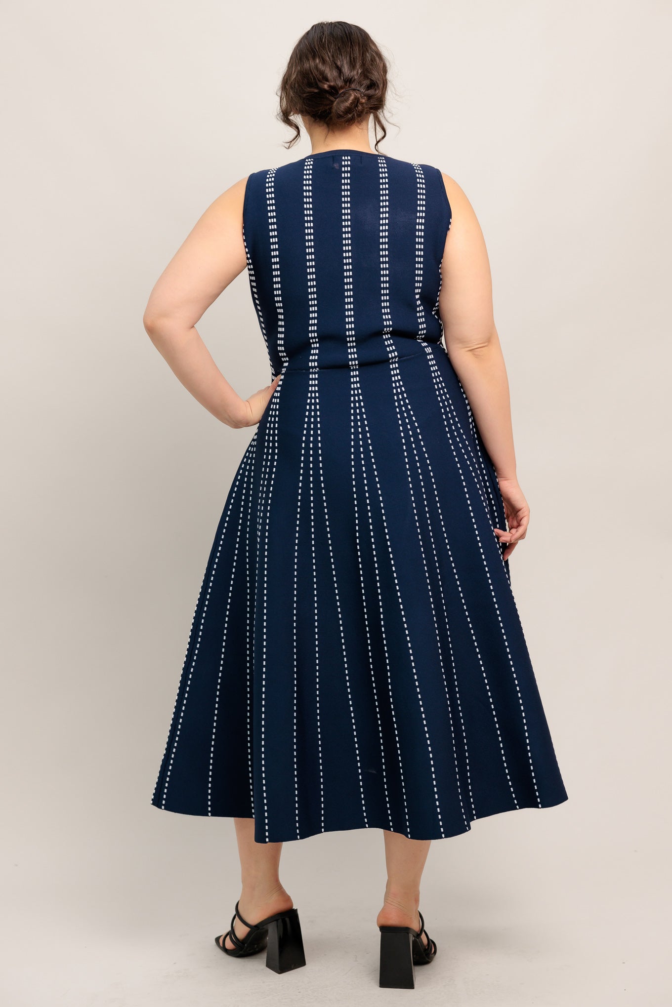 
A jacquard sweater knit midi dress featuring round neckline, sleeveless and circle skirt

Details:

Self : 82% Polyester 18% Spandex

Size &amp; Fit

- Model is 5`8" And Wearing Size Small
- Measurements Taken From Size Small
- Approx. Length: 50" Flying Tomato