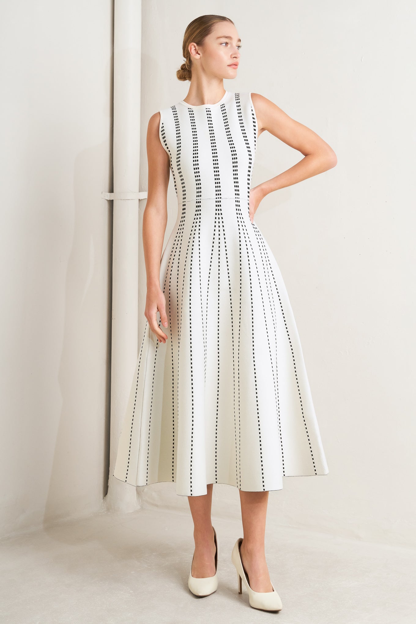 
A jacquard sweater knit midi dress featuring round neckline, sleeveless and circle skirt

Details:

Self : 82% Polyester 18% Spandex

Size &amp; Fit

- Model is 5`8" And Wearing Size Small
- Measurements Taken From Size Small
- Approx. Length: 50" Flying Tomato