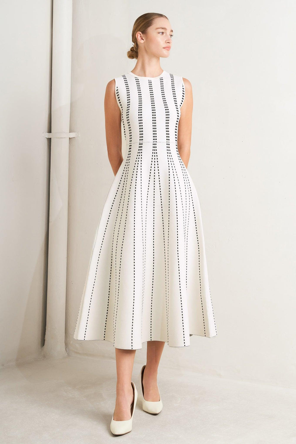 
A jacquard sweater knit midi dress featuring round neckline, sleeveless and circle skirt

Details:

Self : 82% Polyester 18% Spandex

Size &amp; Fit

- Model is 5`8" And Wearing Size Small
- Measurements Taken From Size Small
- Approx. Length: 50" Flying Tomato