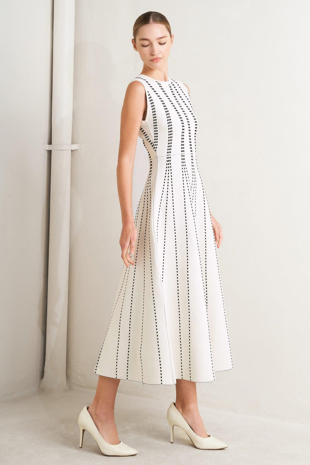 
A jacquard sweater knit midi dress featuring round neckline, sleeveless and circle skirt

Details:

Self : 82% Polyester 18% Spandex

Size &amp; Fit

- Model is 5`8" And Wearing Size Small
- Measurements Taken From Size Small
- Approx. Length: 50" Flying Tomato