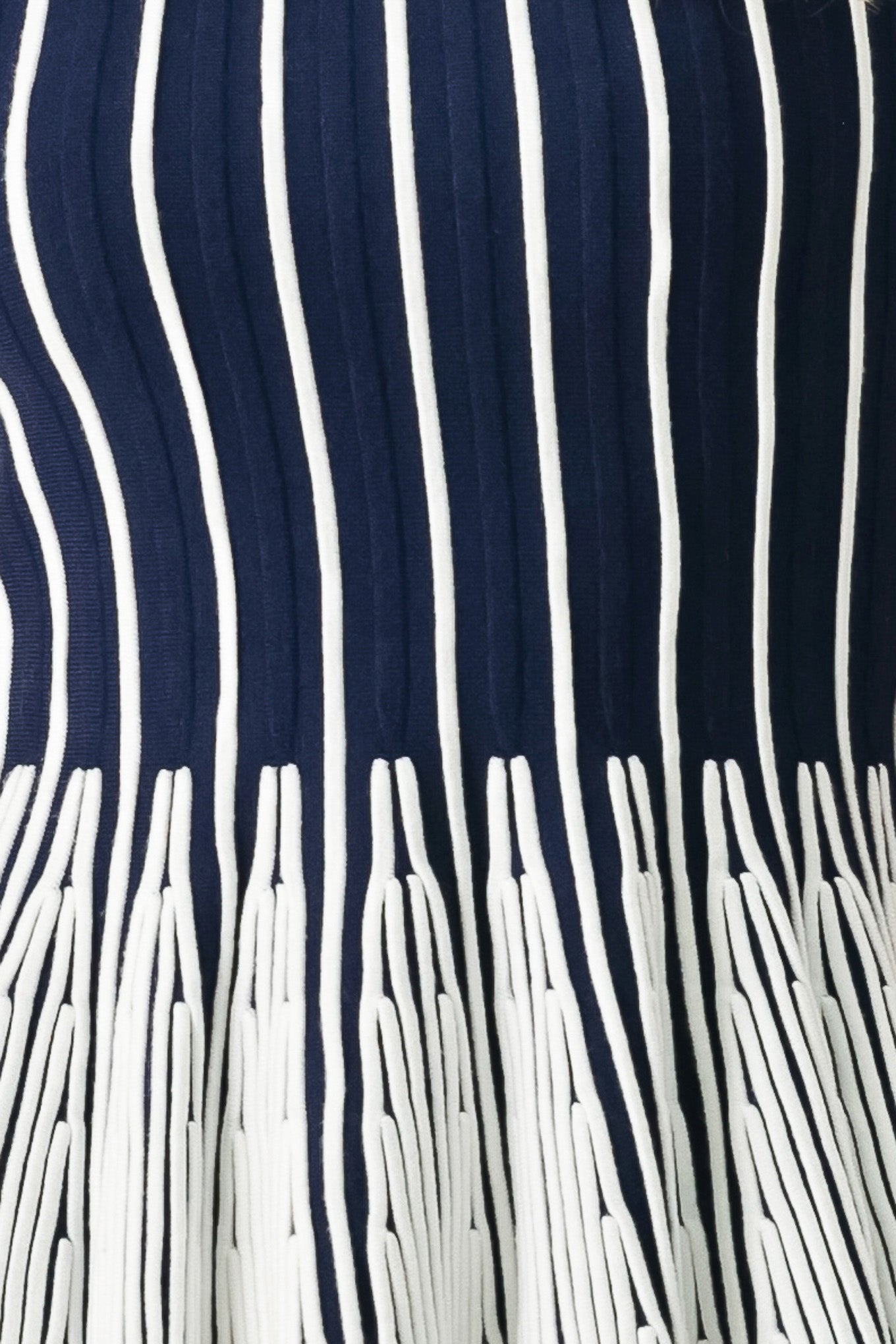 Close up of a navy and white striped sweater knit top with a peplum waist | FREEMARKET