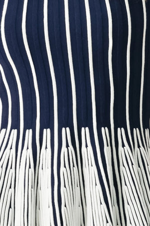 Close up of a navy and white striped sweater knit top with a peplum waist | FREEMARKET