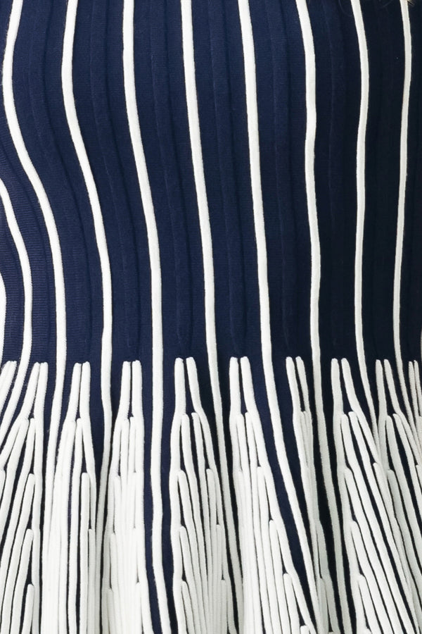 Close up of a navy and white striped sweater knit top with a peplum waist | FREEMARKET