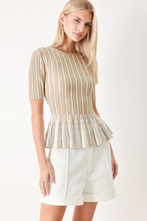Woman wearing a taupe and white striped sweater knit top with a peplum waist | FREEMARKET