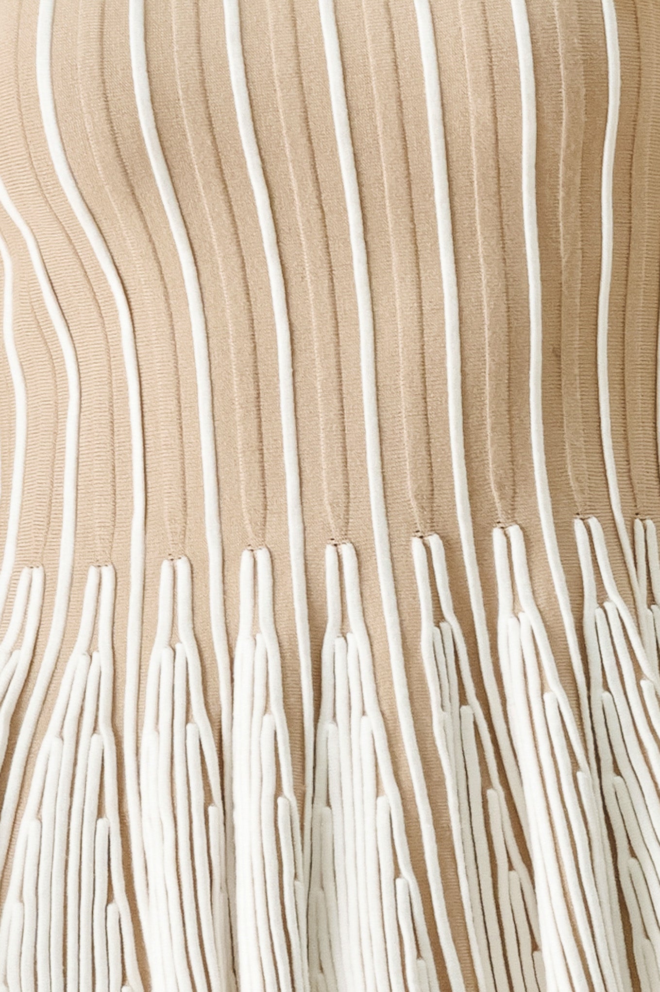 Close up of a taupe and white striped sweater knit top with a peplum waist | FREEMARKET