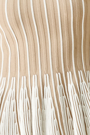 Close up of a taupe and white striped sweater knit top with a peplum waist | FREEMARKET
