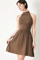 A sweater knit mini dress with halter neckline and back neck button closure