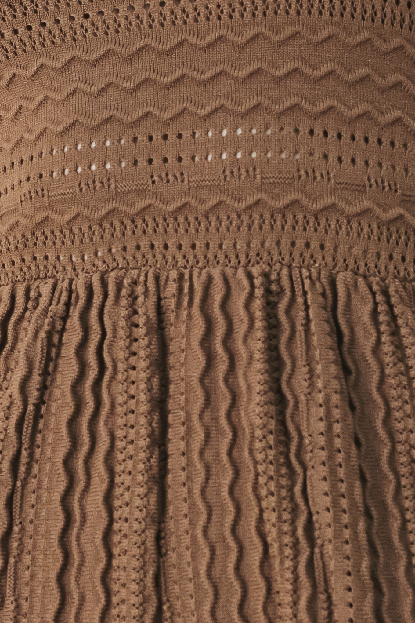 A sweater knit mini dress with halter neckline and back neck button closure