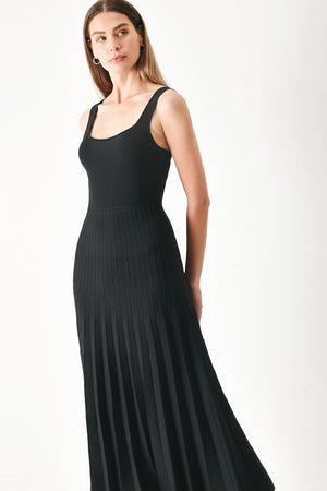 Woman wearing a black sleeveless sweater knit midi dress | Flying Tomato