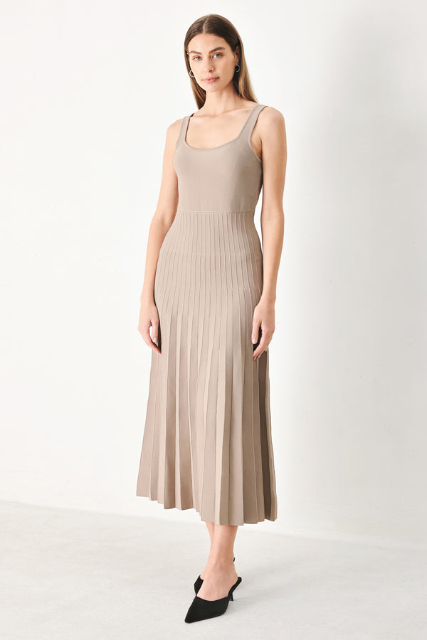 Woman wearing a beige sleeveless sweater knit midi dress | Flying Tomato