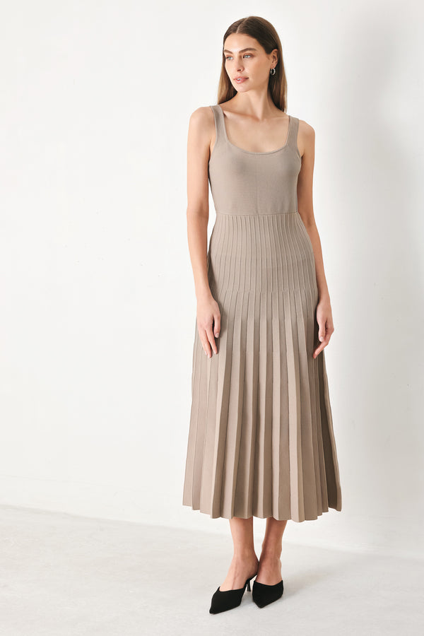 Woman wearing a beige pleated midi dress | Flying Tomato