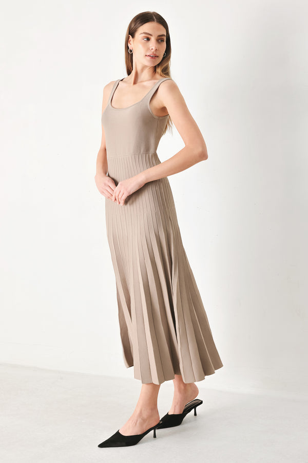 Woman wearing a beige sleeveless sweater knit midi dress | Flying Tomato