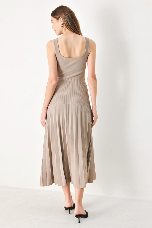 Woman wearing a beige sleeveless sweater knit midi dress | Flying Tomato