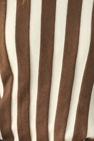 A woman wearing a brown and ivory striped long-sleeve knit top | FREEMARKET