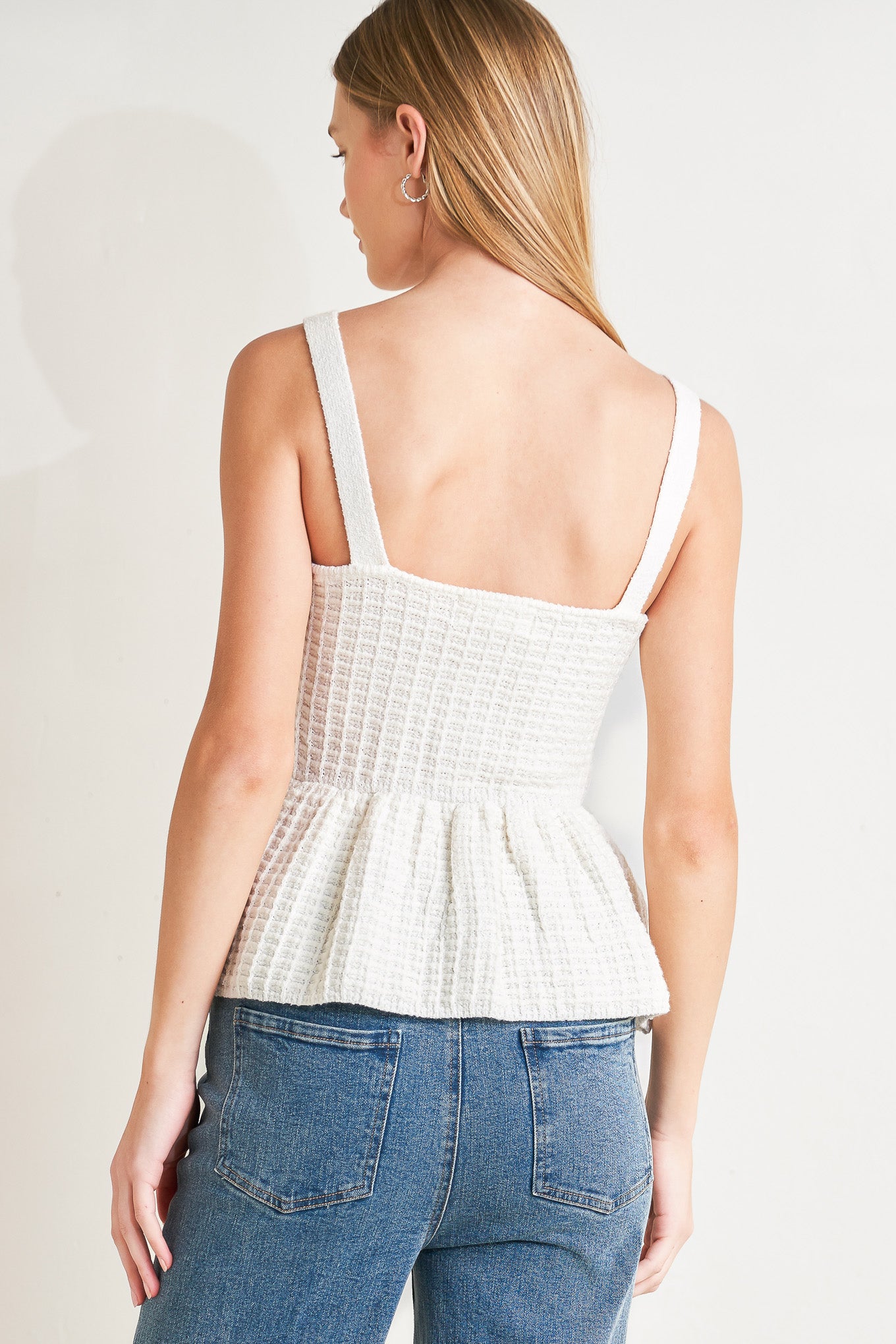 
A sweater knit top featuring straight neckline, straps, jewel button down and peplum

Details:

Self : 58% Polyester 27% Acrylic 15% Nylon

Size &amp; Fit

- Model is 5`8" And Wearing Size Small
- Measurements Taken From Size Small
- Approx. Length: 23"