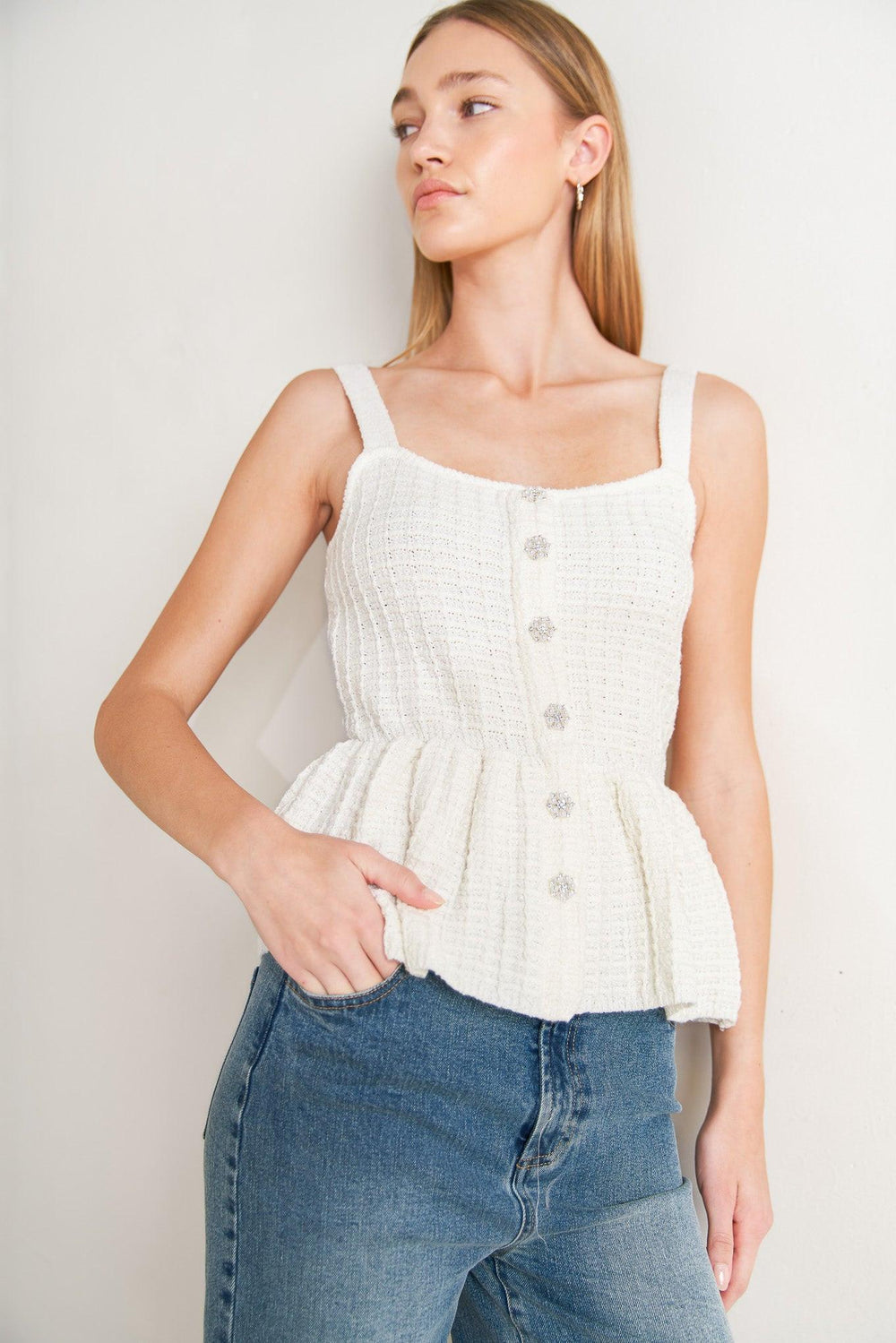 
A sweater knit top featuring straight neckline, straps, jewel button down and peplum

Details:

Self : 58% Polyester 27% Acrylic 15% Nylon

Size &amp; Fit

- Model is 5`8" And Wearing Size Small
- Measurements Taken From Size Small
- Approx. Length: 23"