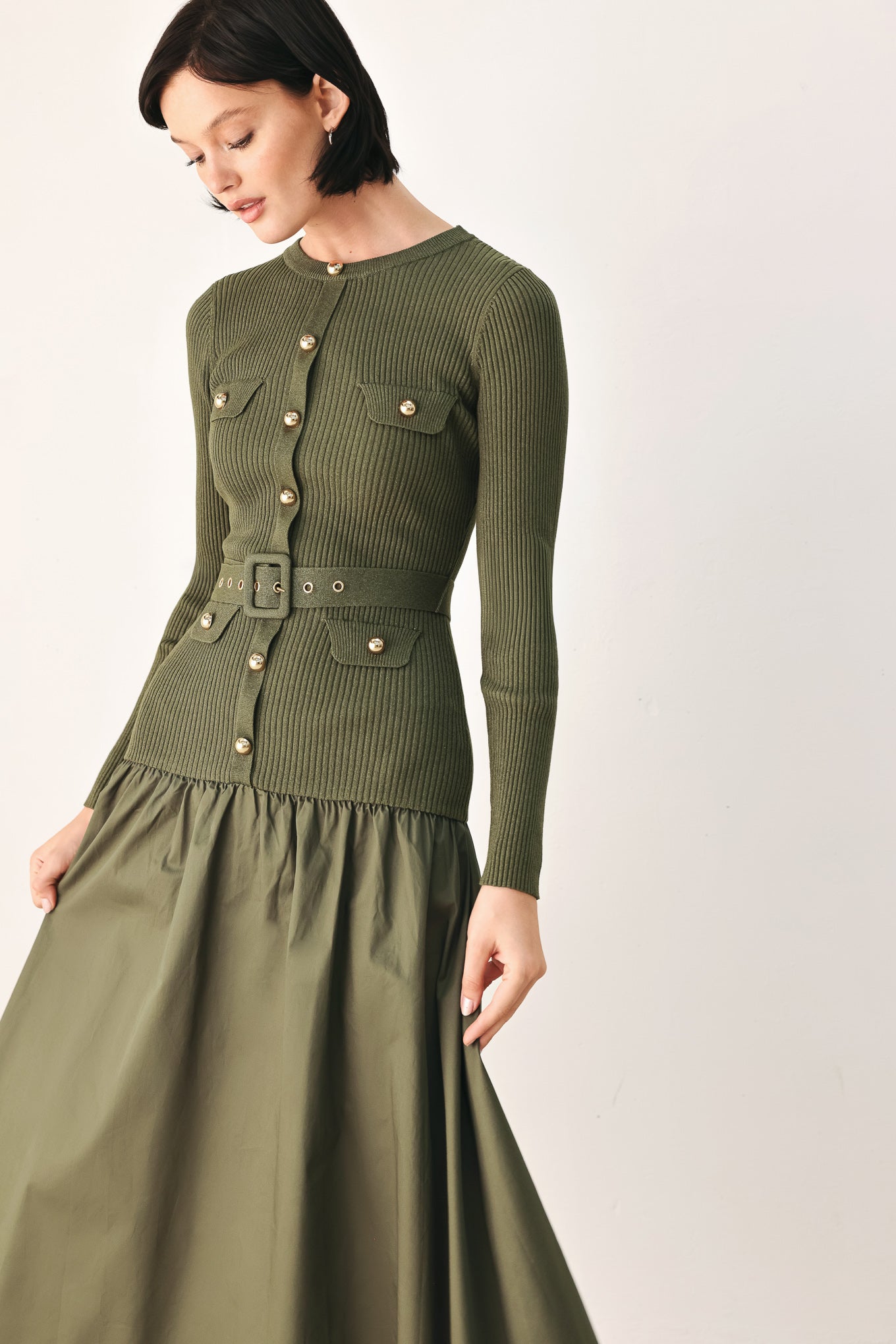 A woman models an olive green ribbed midi dress with a matching belt and gold-tone buttons, and a flared drop-waist skirt | FREEMARKET