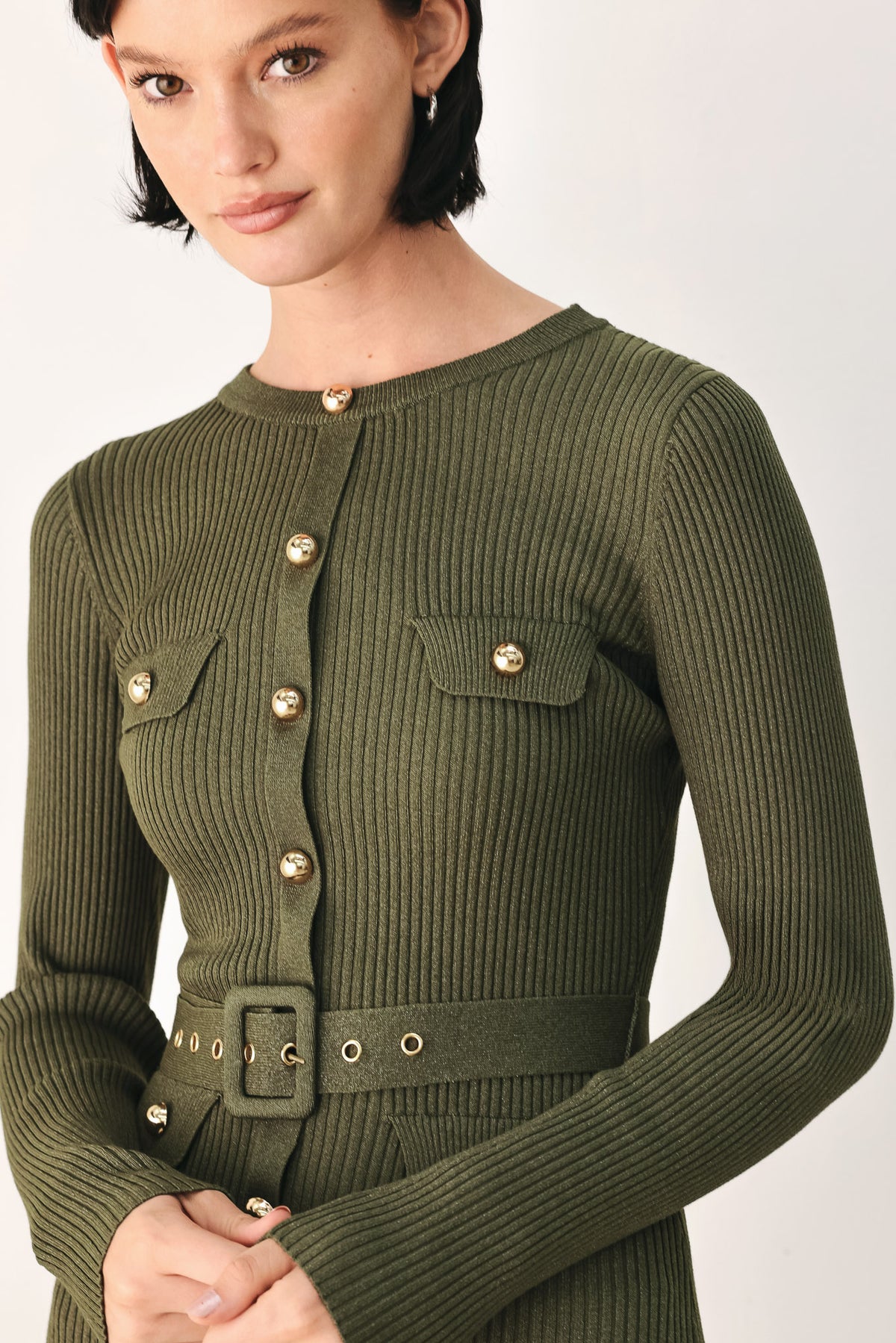 A woman models an olive green ribbed midi dress with a matching belt and gold-tone buttons, and a flared drop-waist skirt | FREEMARKET