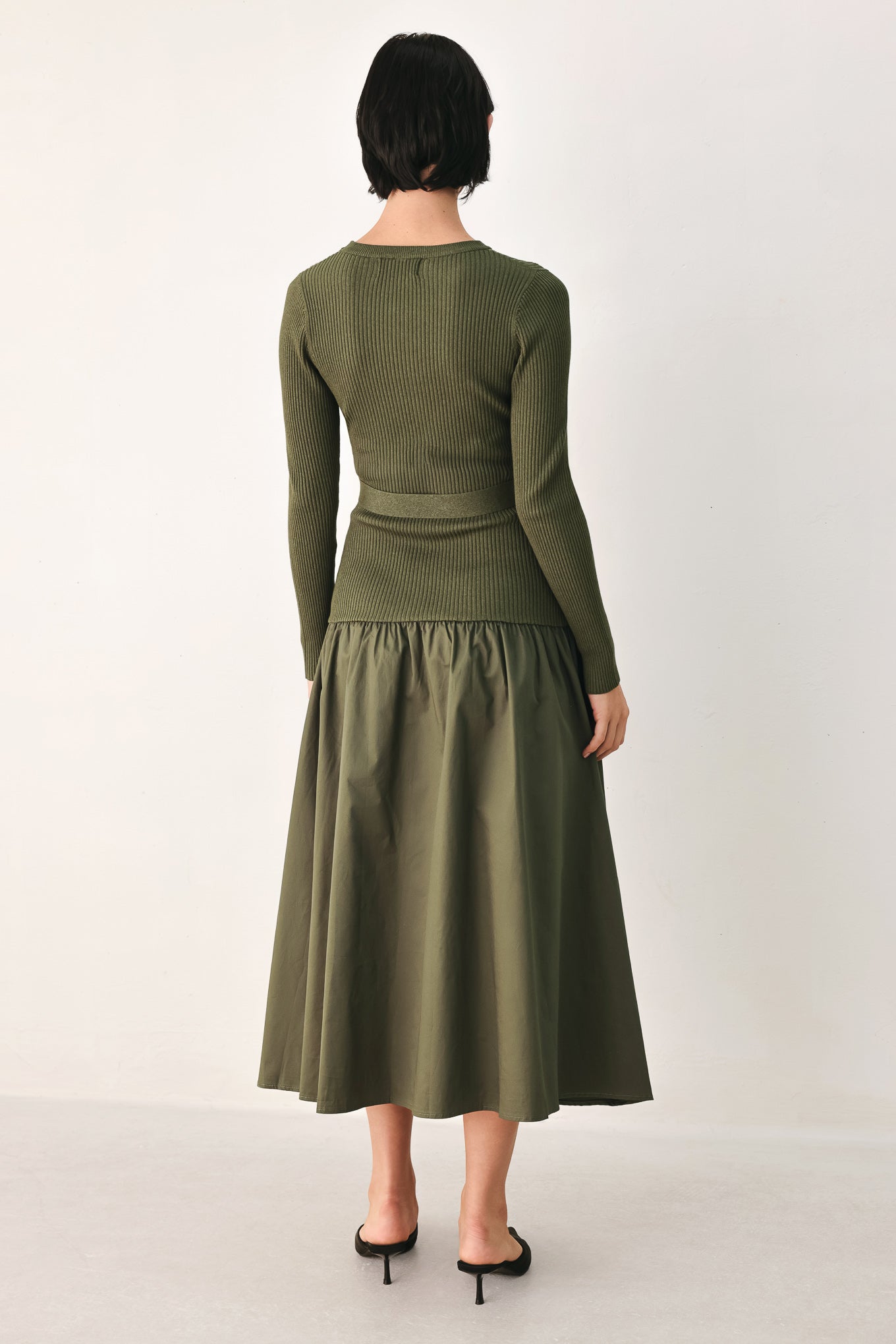A woman models an olive green ribbed midi dress with a matching belt and gold-tone buttons, and a flared drop-waist skirt | FREEMARKET