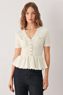 A woman wearing a short-sleeve off-white sweater knit blouse with a scalloped V-neckline, front buttons, and chest pockets | FREEMARKET