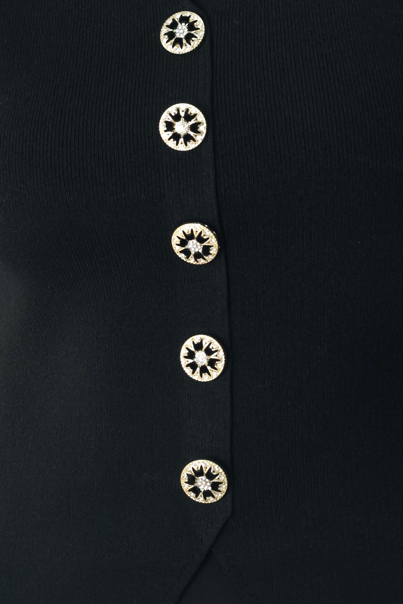 Close up of a black sweater knit top featuring square neckline, woven puff sleeve and front button detail | FREEMARKET