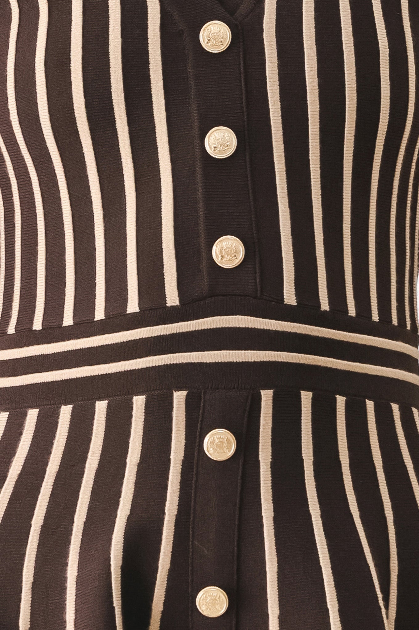 A woman modeling a short-sleeve V-neck dress with vertical brown and beige stripes, a buttoned front, and a flared skirt | FREEMARKET