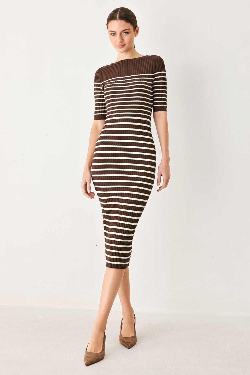 Woman wearing a brown and white horizontal stripped ribbed sweater knit midi dress | FREEMARKET