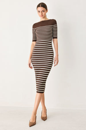 Woman wearing a brown and white horizontal stripped ribbed sweater knit midi dress | FREEMARKET